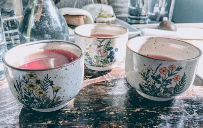 Close-up of tea cups on table