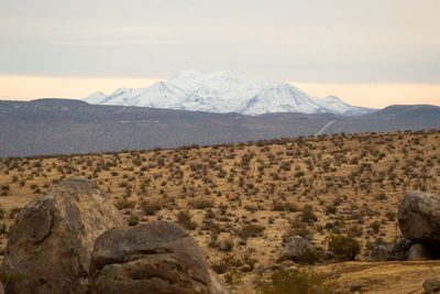 Scenic view of snowcapped mountains against sky