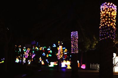 Low angle view of illuminated christmas tree at night