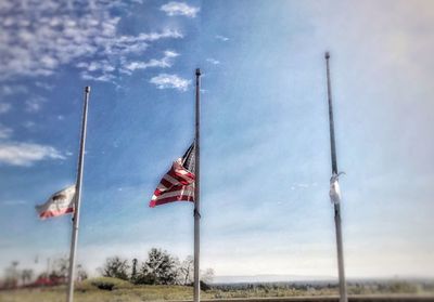 Low angle view of flag against sky