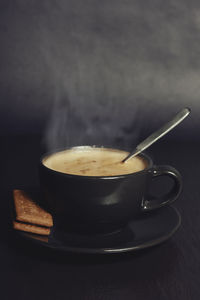 Close-up of coffee cup on table