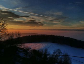 Scenic view of silhouette landscape against romantic sky at sunset