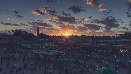 High angle view of people in city at sunset