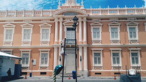 Woman standing in front of building