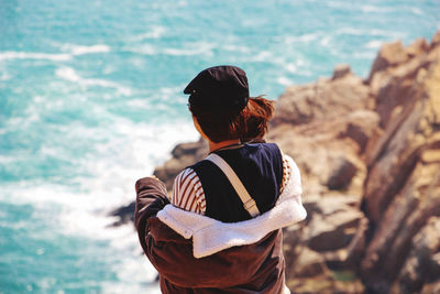 Rear view of woman looking at sea