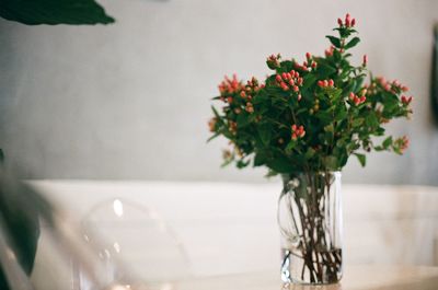 Close-up of flower vase on table at home