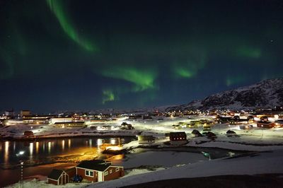 Illuminated mountain against sky at night