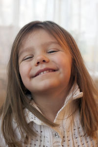 Close-up portrait of cute smiling girl