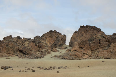 Rock formation on land against sky