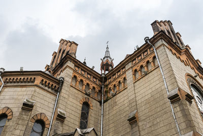 Low angle view of old building against sky