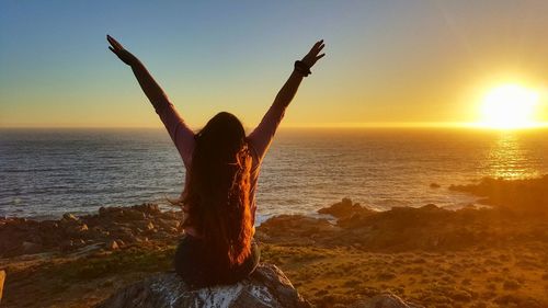 Scenic view of sea against clear sky at sunset