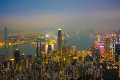 High angle view of city lit up at night