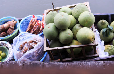 Fruits in basket for sale at market stall