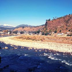 Scenic view of landscape against clear blue sky