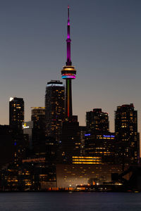 Illuminated buildings in city at night sunset cn tower
