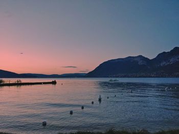 Scenic view of sea against clear sky at sunset