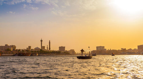 Scenic view of buildings against sky during sunset