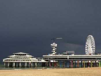 View of amusement park by sea