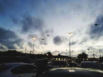 Cars on road against sky