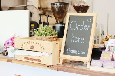 Blackboard with text on table at cafe