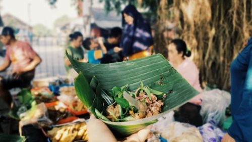 Close-up of people in market