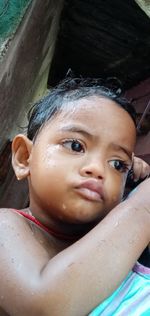 Close-up portrait of cute girl looking away