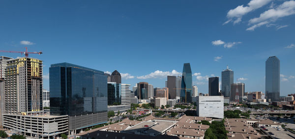 Modern buildings in city against sky