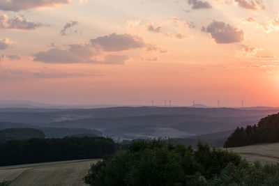 Scenic view of landscape against sky during dawn