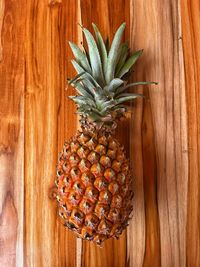 Close-up of pineapple on wooden table