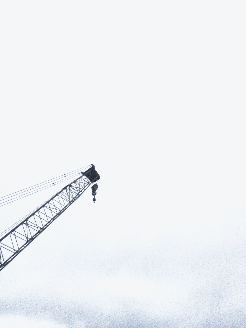 low angle view, copy space, clear sky, sky, silhouette, crane - construction machinery, connection, technology, outdoors, transportation, built structure, no people, street light, day, development, dusk, architecture, construction site, construction, electricity