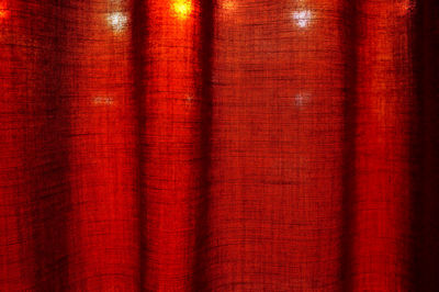 Full frame shot of illuminated lights seen from curtain