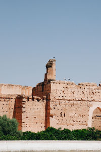 Low angle view of historical building against clear blue sky