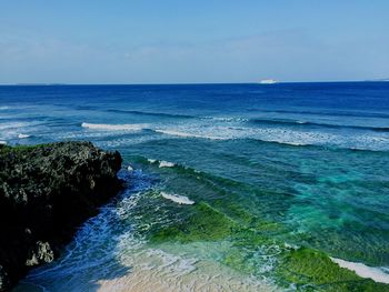 Scenic view of sea against clear blue sky