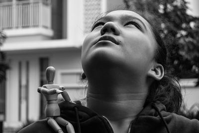 Portrait of woman looking up