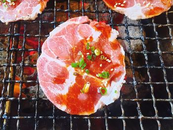 High angle view of meat on barbecue grill