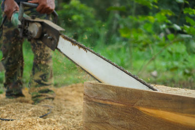 Close-up of wooden fence on field