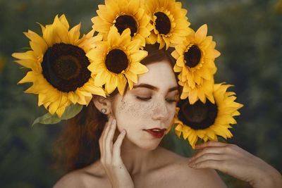 Close-up of woman wearing sunflowers