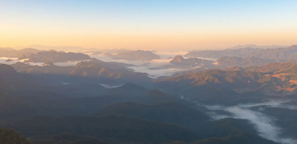 Scenic view of mountains against sky during sunset