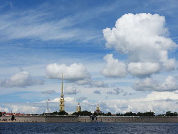 View of buildings against cloudy sky