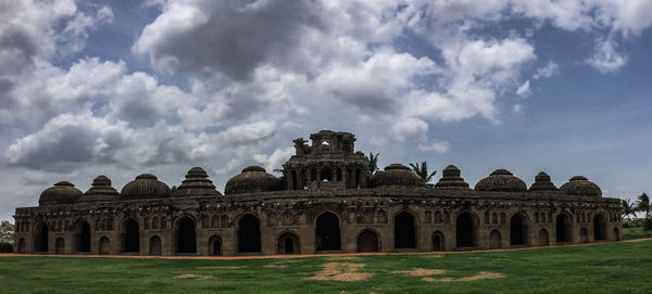 Ruins of building against cloudy sky