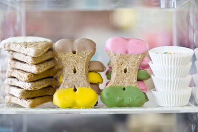 Close-up of desserts arranged in display case at store