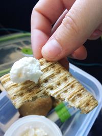 Close-up of hand holding snack