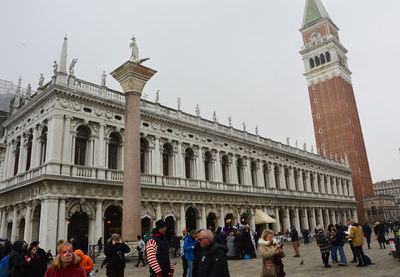 People in front of historical building