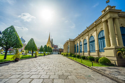 Street amidst buildings against sky