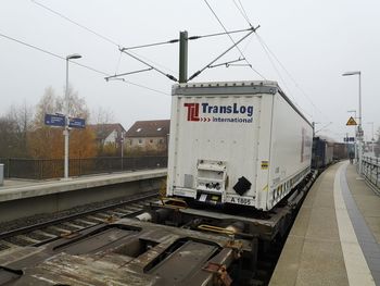 Train on railroad station platform against sky