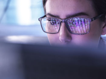 Young scientist examining dna data on computer
