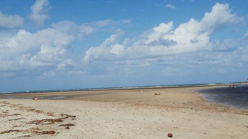 Scenic view of sea against cloudy sky