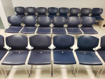 High angle view of chairs on table