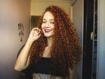 Portrait of smiling young woman at home