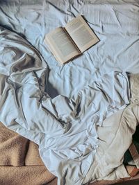 High angle view of crumpled on bed
